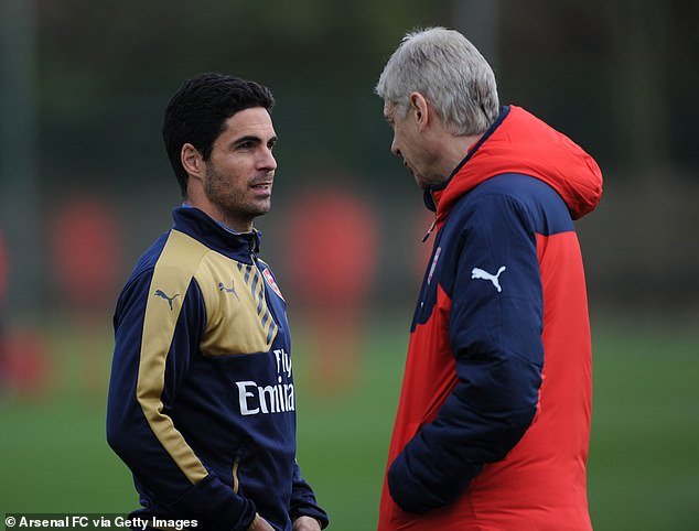 Mikel Arteta pictured (left) in 2016, when he was Arsenal captain, speaking to Wenger (right)