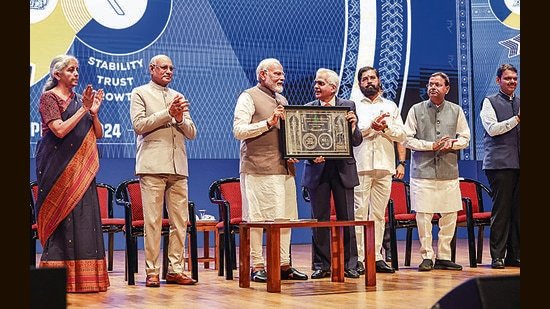 Prime Minister Narendra Modi with Maharashtra Governor Ramesh Bais, Union Finance Minister Nirmala Sitharaman, Chief Minister Eknath Shinde, Union Minister of State for Finance Pankaj Chaudhary, Deputy Chief Minister Devendra Fadnavis and RBI Governor Shaktikanta Das during a ceremony marking 90 years of the Reserve Bank of India, in Mumbai on Monday. (PTI)